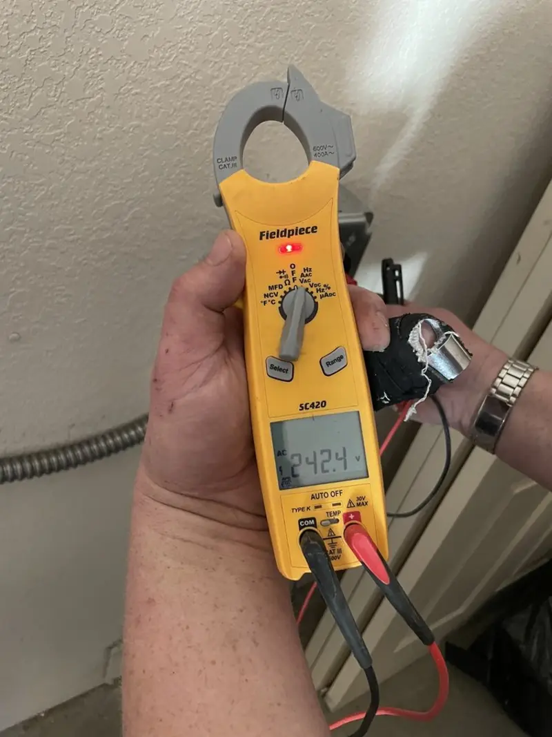 Voltage testing with clamp meter during Outlet Installation in O'Hara